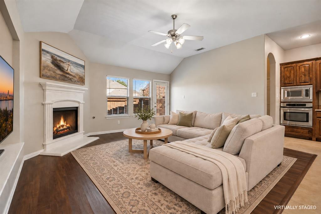 Cozy living room open to the kitchen and breakfast room.