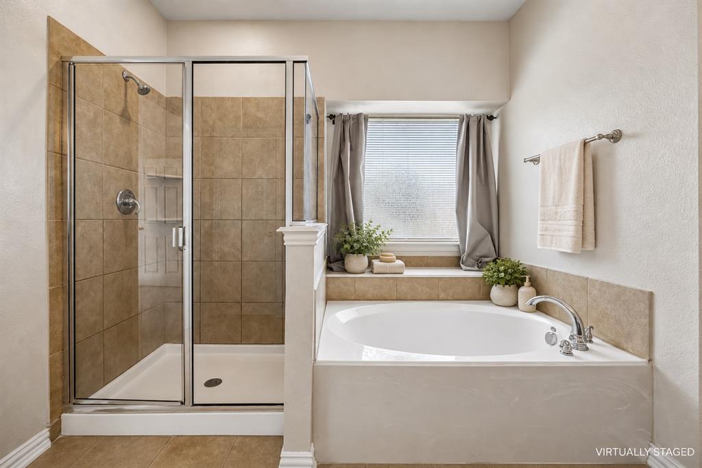 Dual sinks, spacious and separate shower, separate water closet, linen closet and dual sinks.