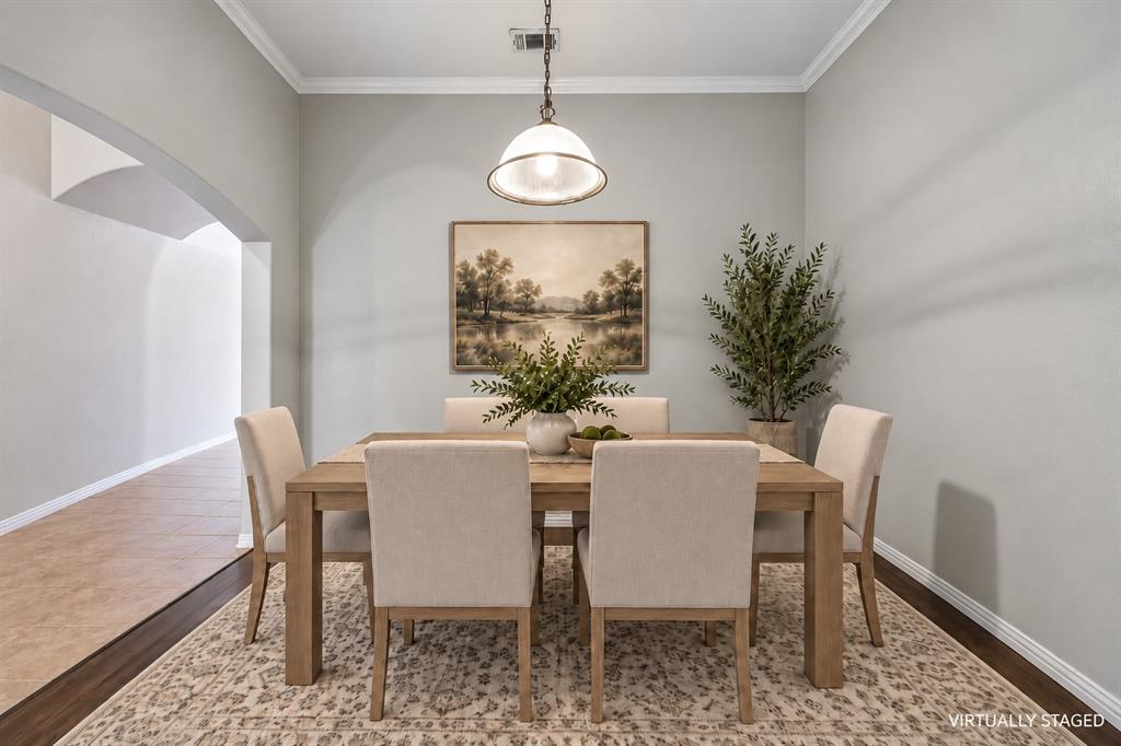 The formal dining room is ready to elevate your dinners and entertaining.