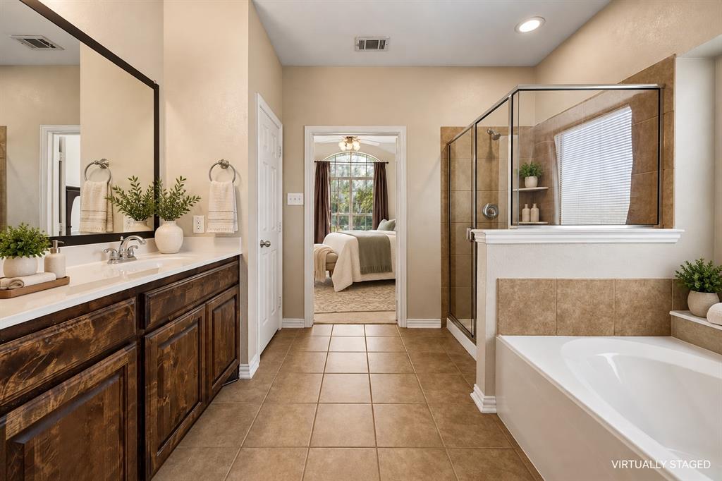 Dual sinks, spacious and separate shower, separate water closet, linen closet and dual sinks.