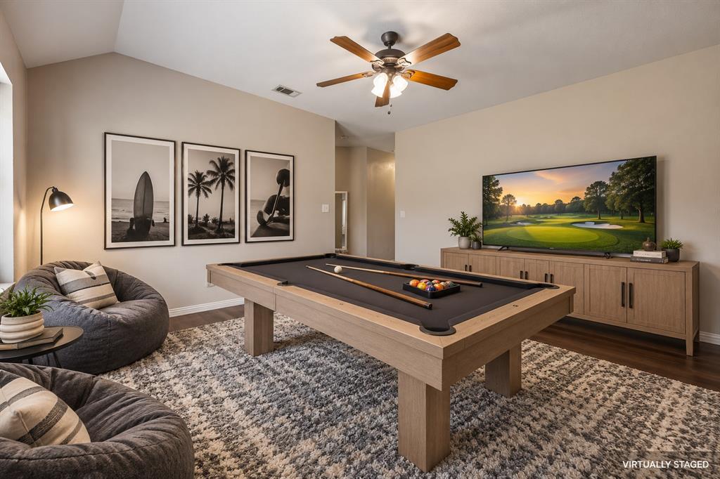 The 2 secondary bedrooms are divided by this oversized gameroom.