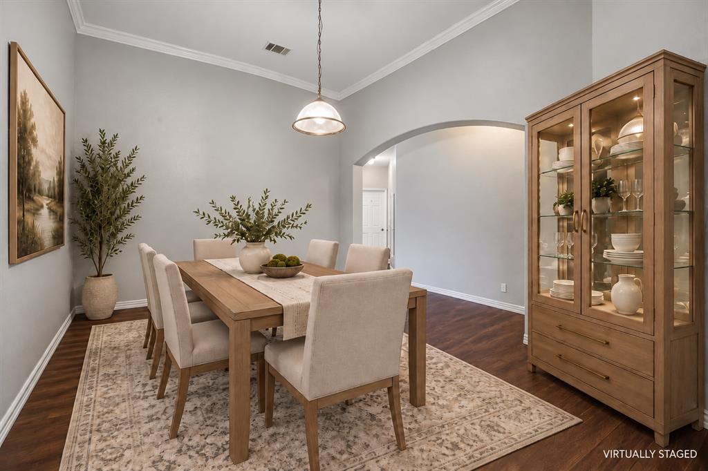 The formal dining room is ready to elevate your dinners and entertaining.
