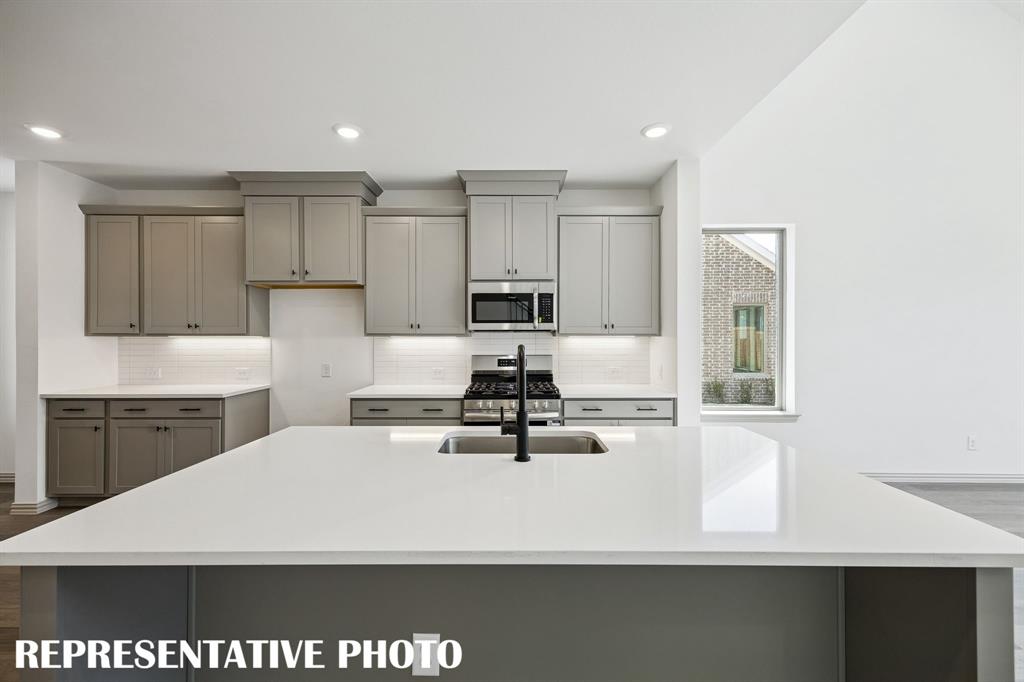 Friends and family will love gathering round this beautiful kitchen island!  REPRESENTATIVE PHOTO