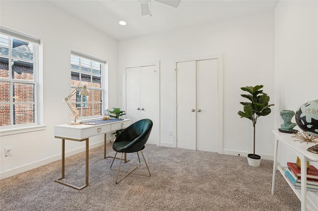 Room featuring neutral wall tones, wall-to-wall carpeting, dual closets with traditional doors, and large windows with integrated blinds