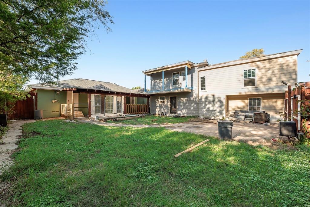 Backyard featuring a concrete patio, a covered pergola, a second-story deck, and horizontal siding