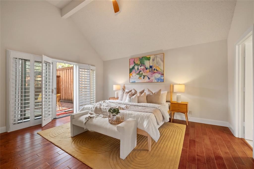 main bedroom with sliding doors leading to patio
