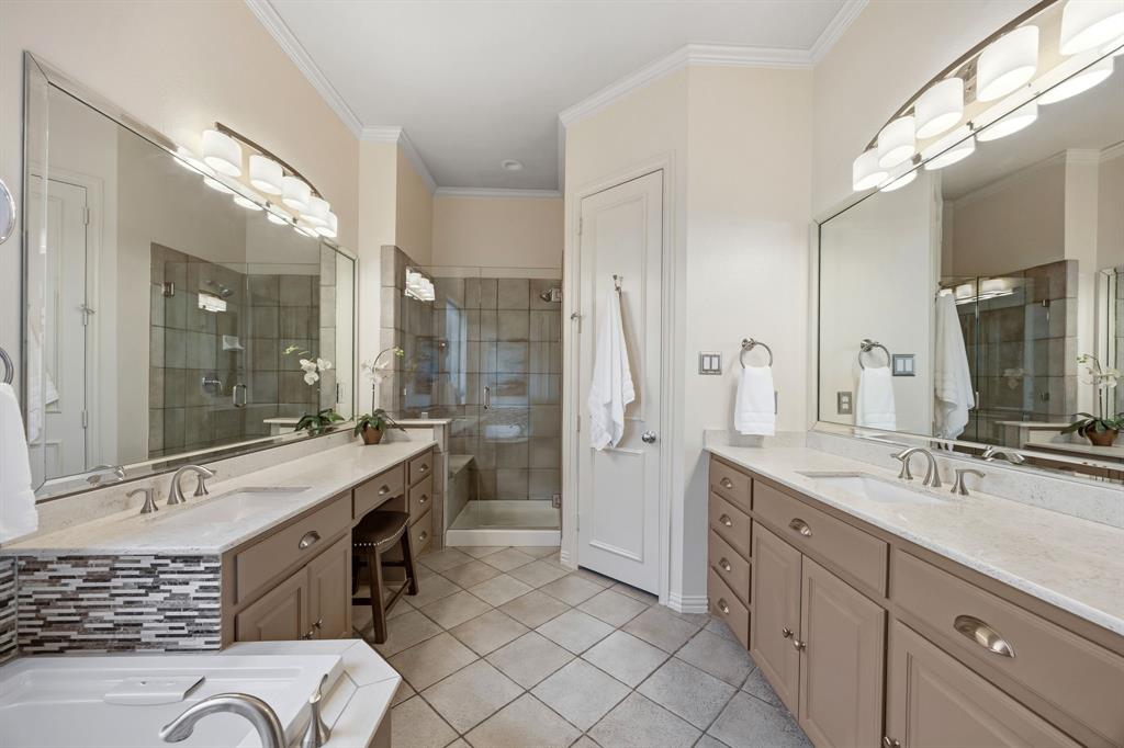 Primary bathroom has SO much space and storage