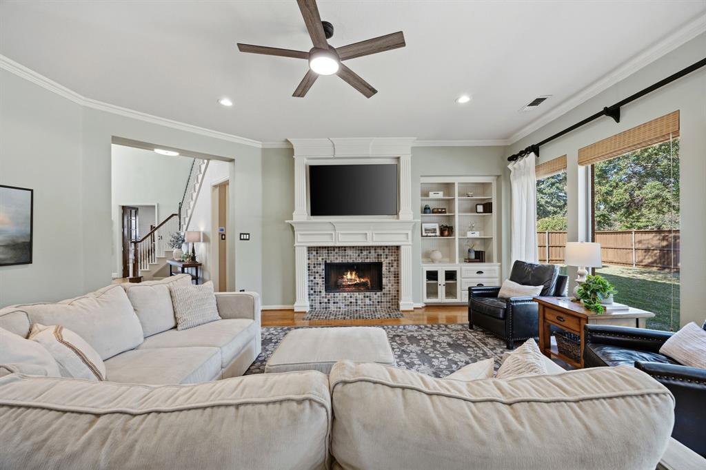 Enjoy this space with a comfy couch, a warm fire and a wall of windows.