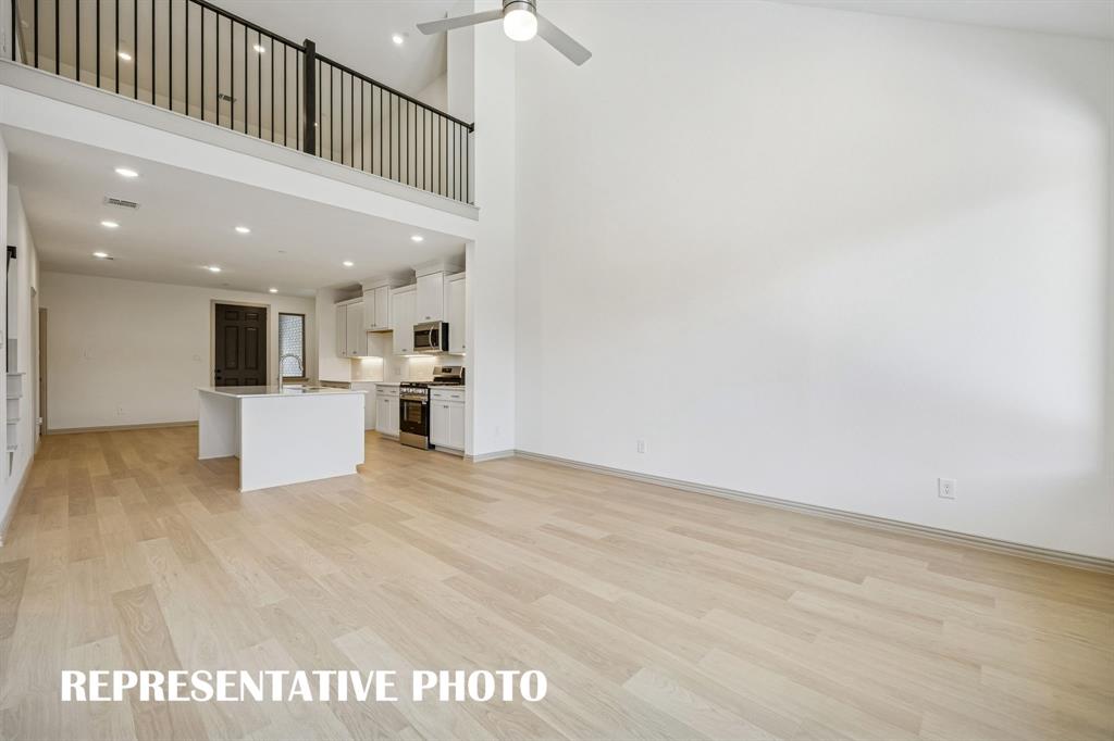 With the family room open to the game room, you'll enjoy a multi level entertainment zone in this fantastic floor plan.  REPRESENTATIVE PHOTO