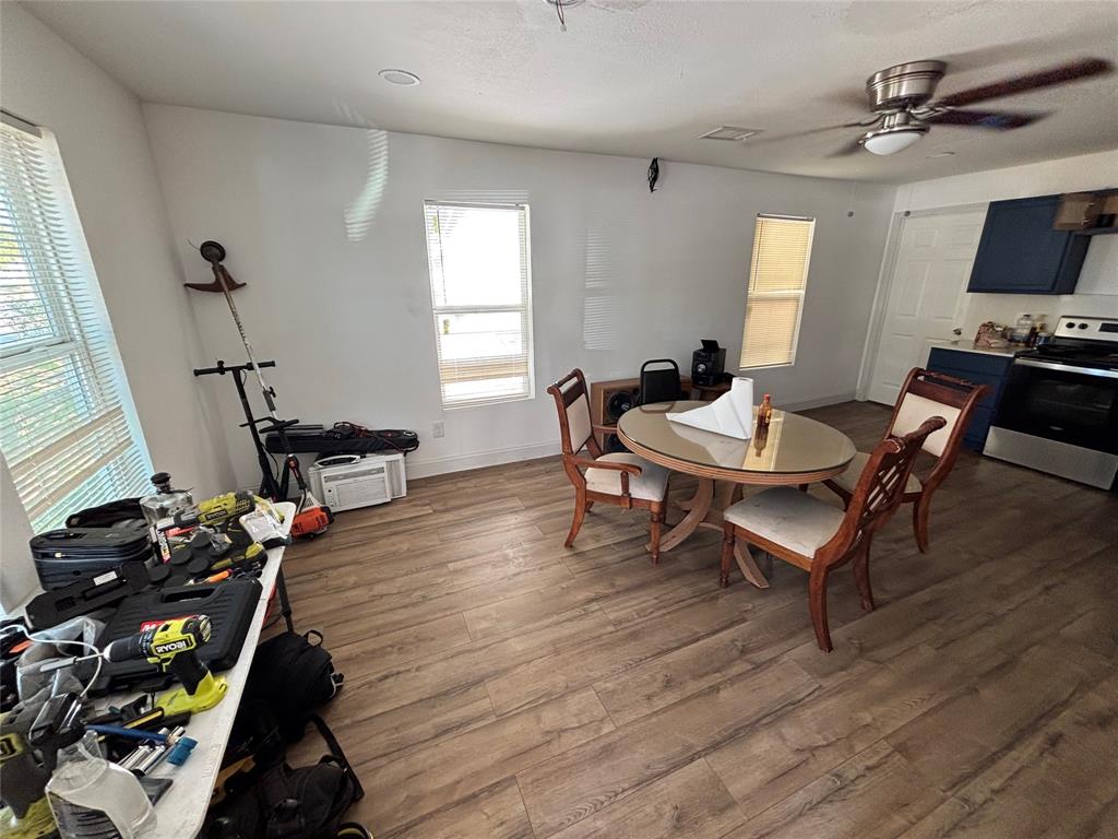 Wood-finish flooring, ceiling fan, and multi-pane windows
