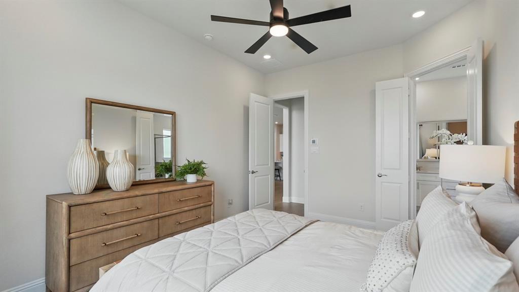 Room featuring recessed lighting, a multi-blade ceiling fan with integrated light, and smooth-finish interior doors