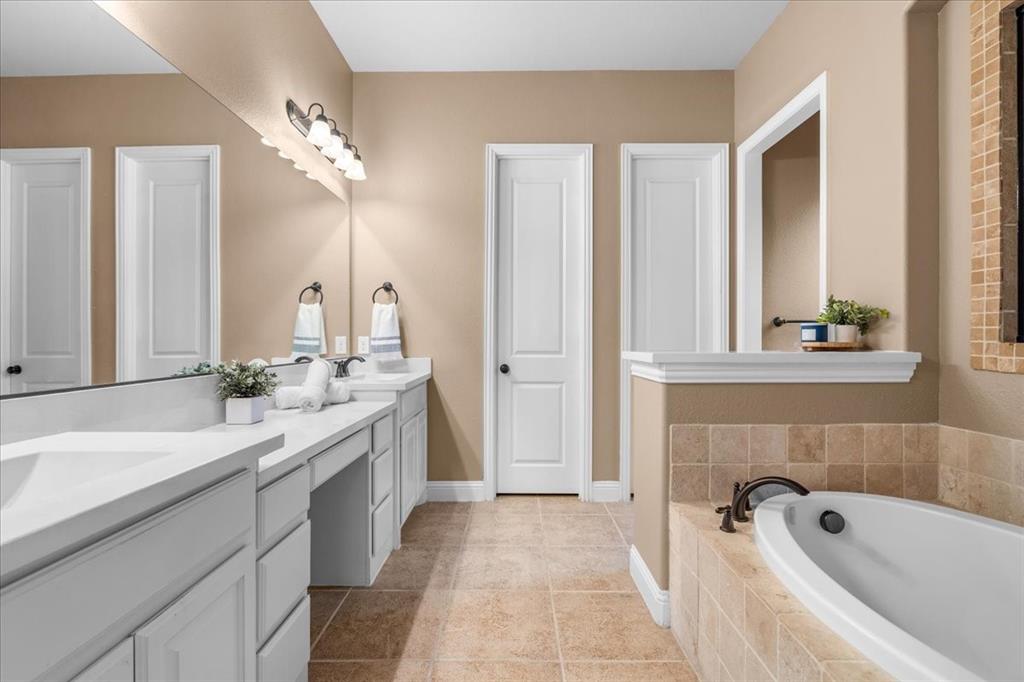 Primary bathroom with walk in shower and soaking tub