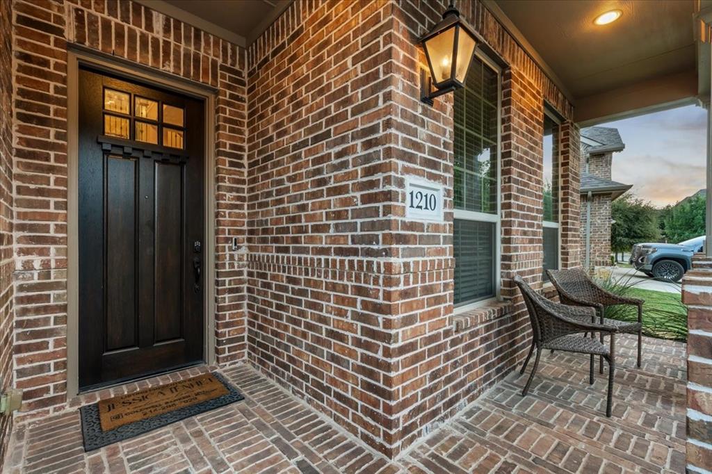 Brick-draped front porch