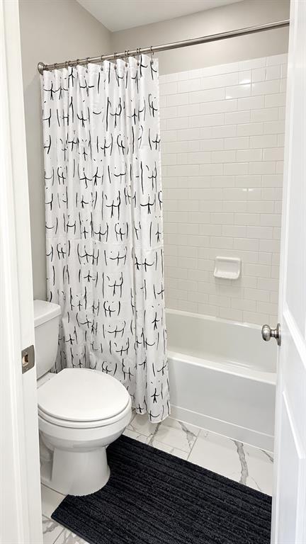 Shower and tub combo in the secondary bathroom.
