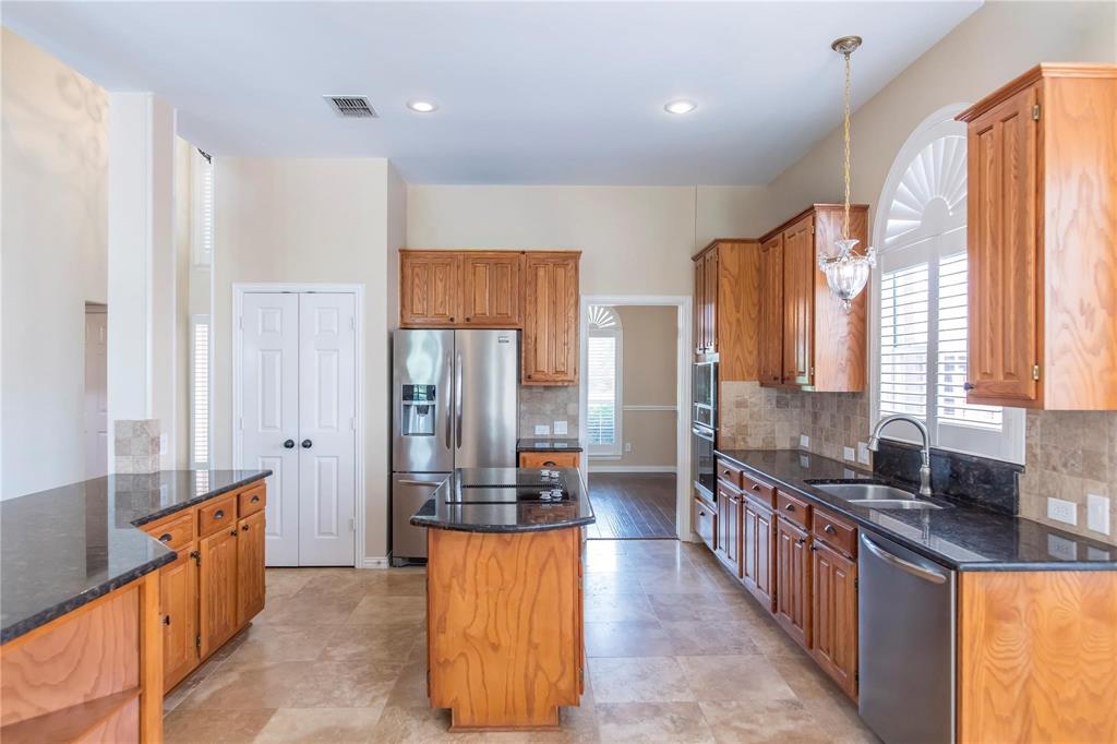 Well-equipped kitchen with stainless appliances, ample counter space and easy flow to the breakfast area.