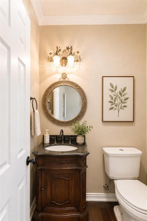 Stylish powder bath with rich wood vanity and designer mirror - convenient for guests.