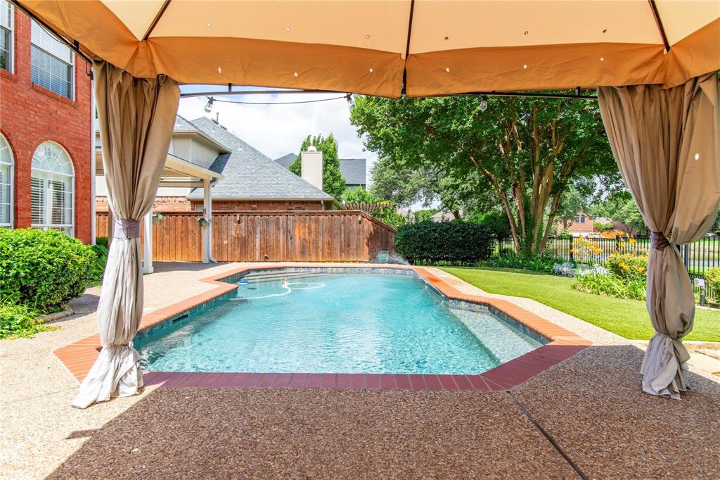 Shaded cabana overlooking the pool - your private backyard escape.