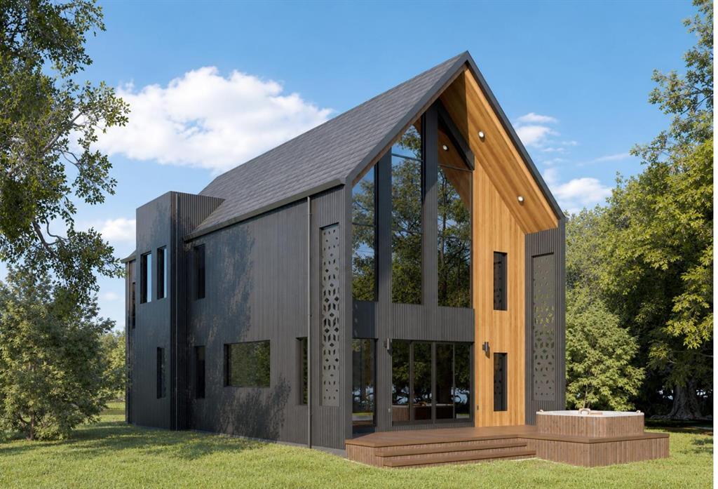 Modern architectural exterior featuring vertical wood-finish siding, floor-to-ceiling windows, decorative laser-cut metal panels, a stepped wood-finish deck, and a built-in exterior soaking tub