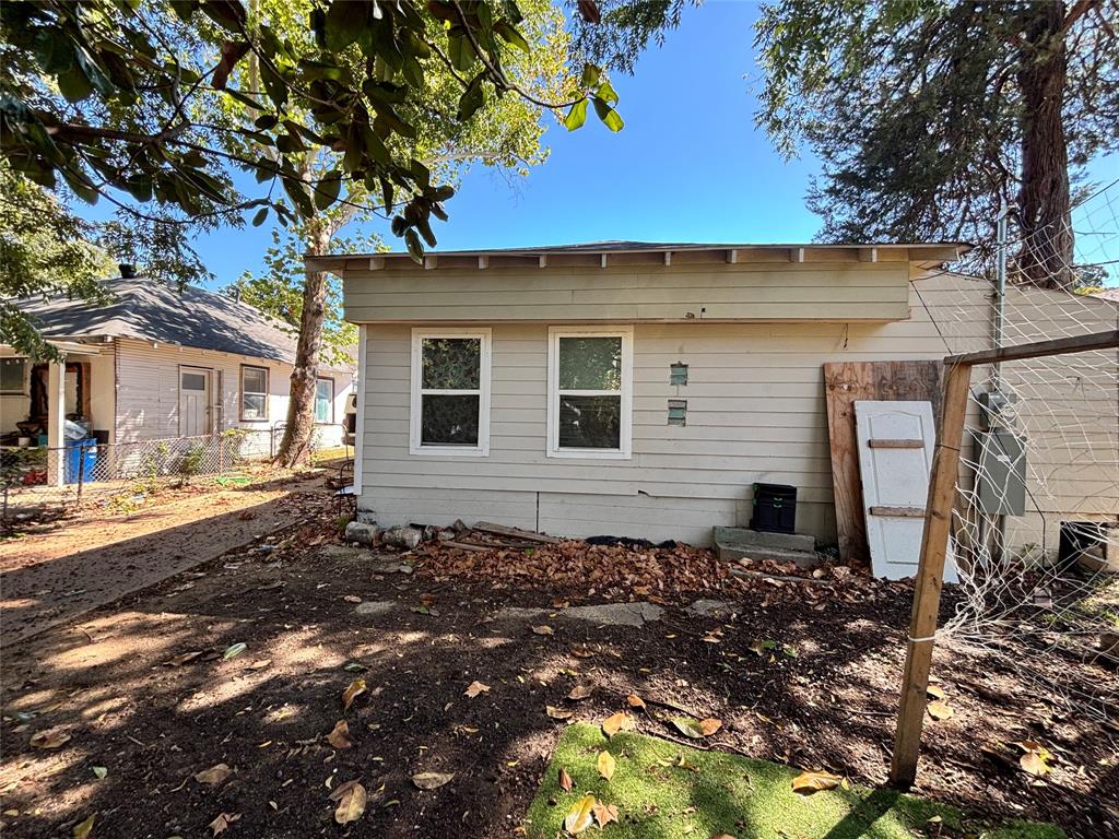 Horizontal siding exterior with dual windows and overhanging eaves