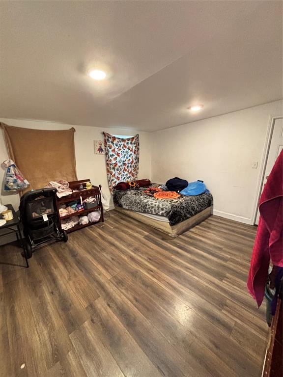 Interior room featuring wood-finish flooring and recessed lighting