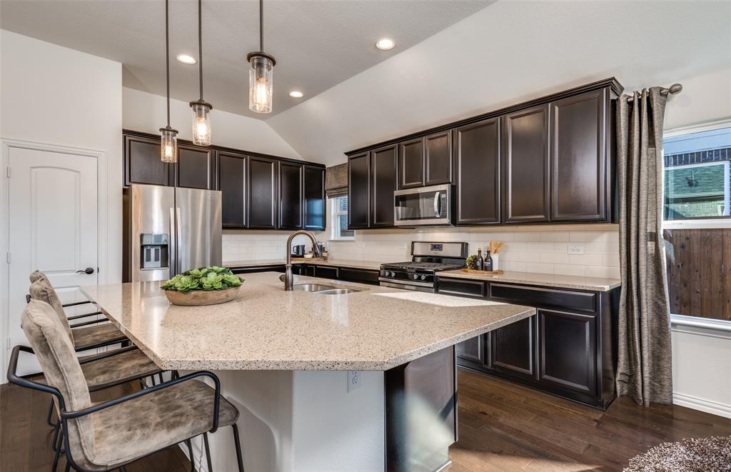 *Model Representation - Spacious kitchen with eat-in bartop island *Model Representation - Spacious kitchen with eat-in bartop island