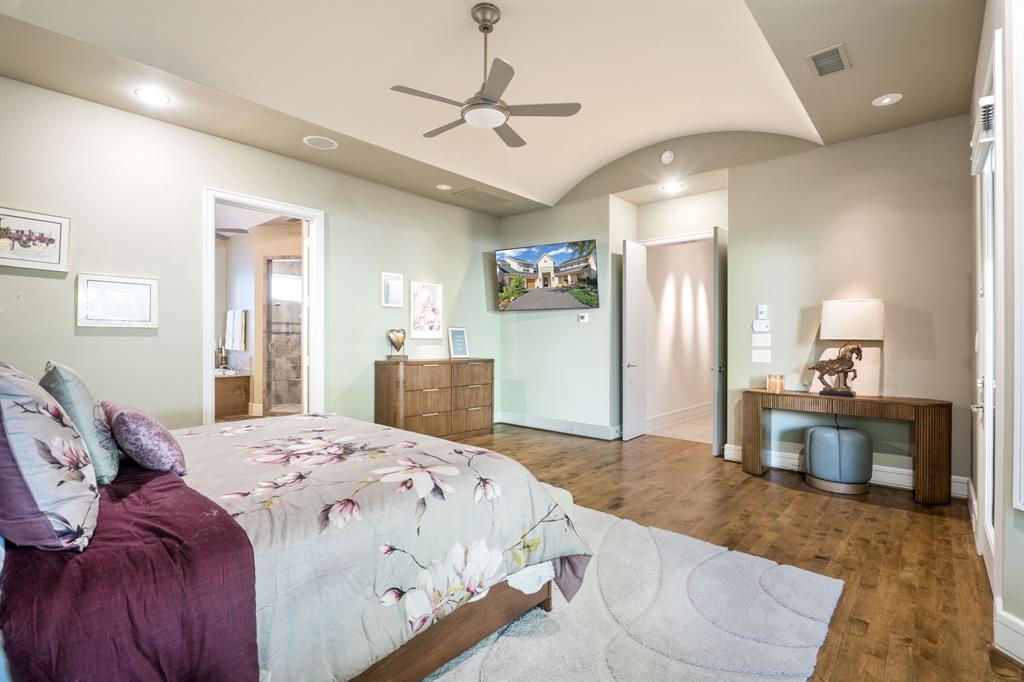 Barrel-vaulted ceiling, wood-finish flooring, recessed lighting, and ceiling fan with integrated light fixture