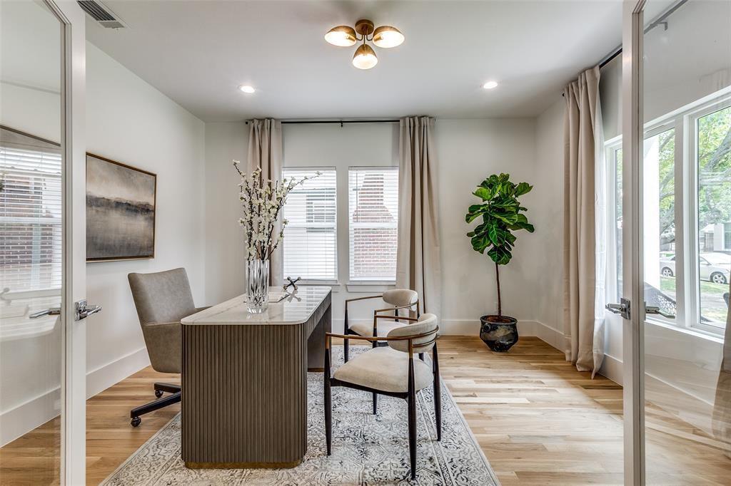 French door entry, wood-finish flooring, recessed lighting, multi-bulb ceiling fixture, and dual-pane windows