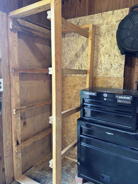 Built-in wood shelving unit featuring integrated wall-mounted supports and oriented strand board paneling