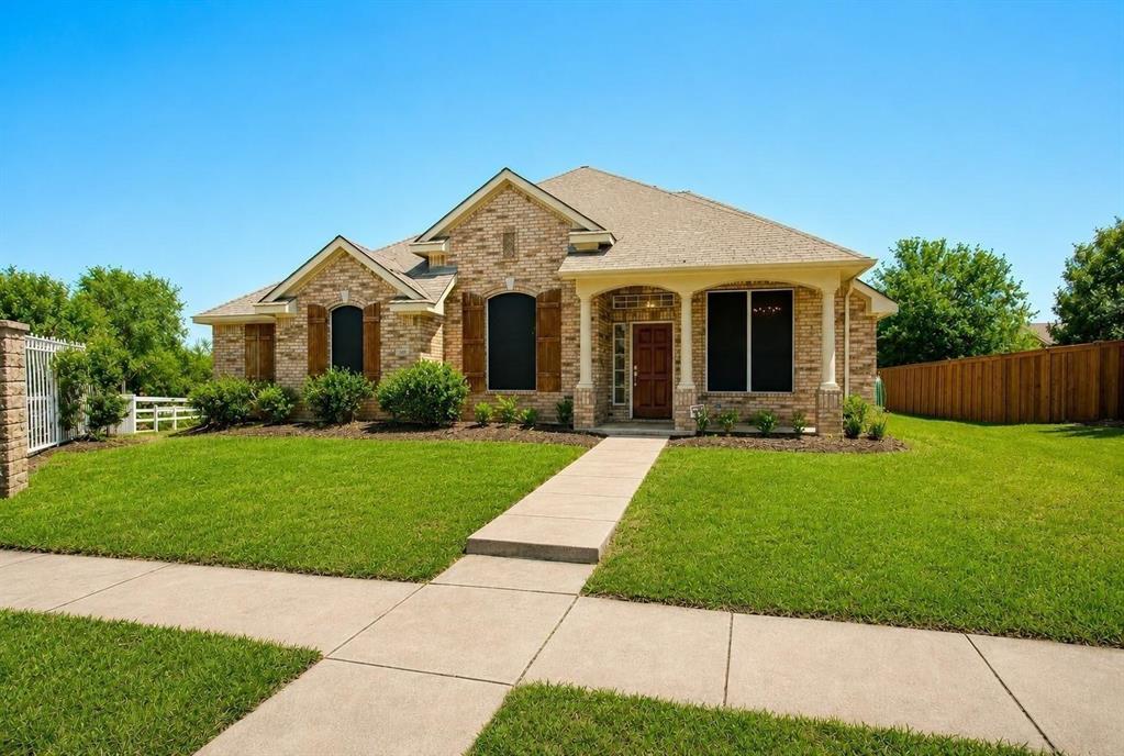 Brick exterior featuring decorative shutters, a covered front porch with columns, and a concrete walkway Brick exterior featuring decorative shutters, a covered front porch with columns, and a concrete walkway