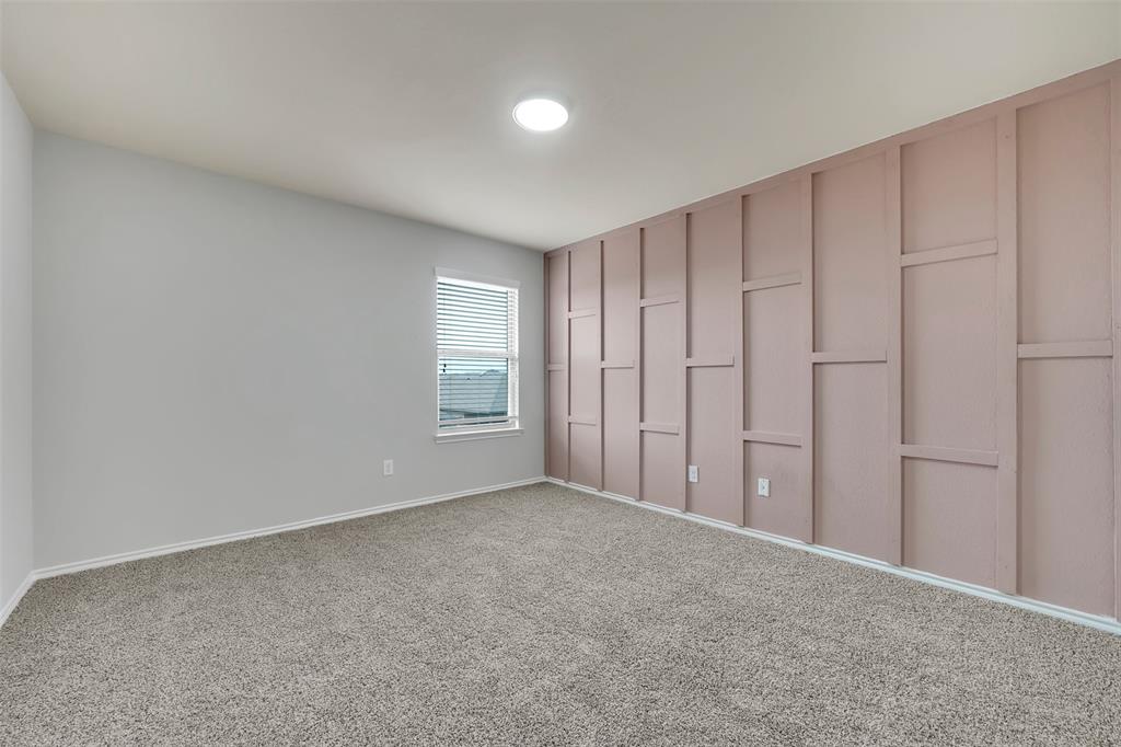 Unfurnished bedroom with carpet