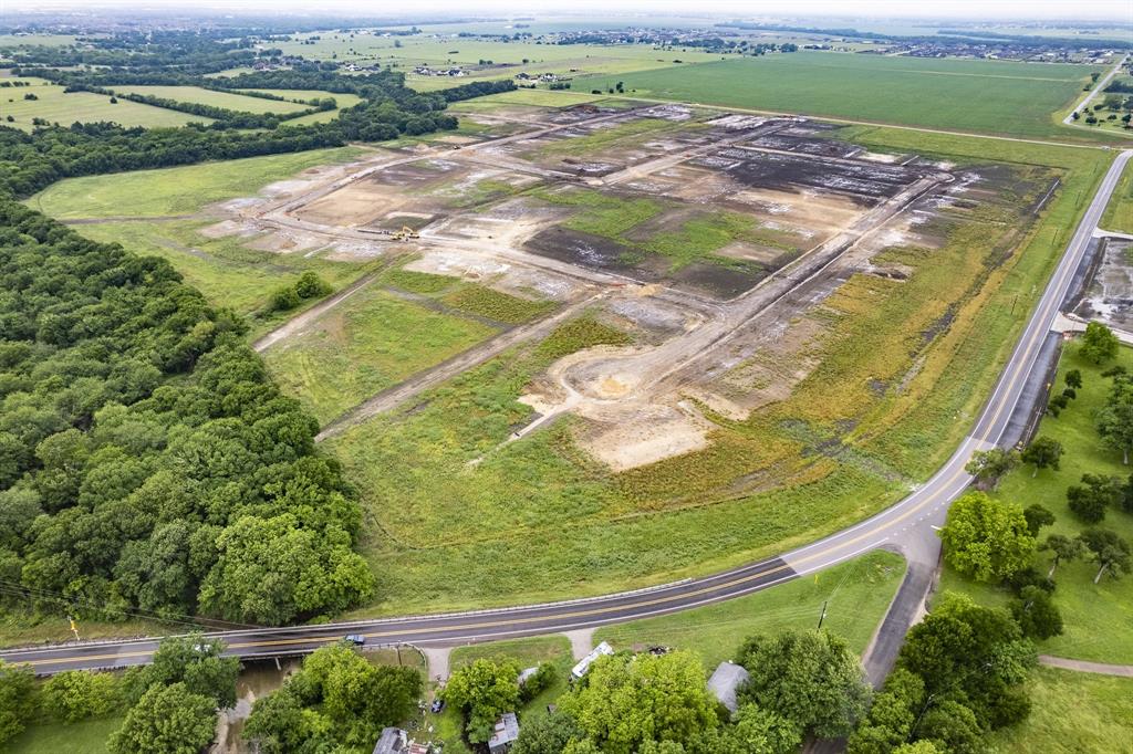 Expansive land parcel featuring established tree lines, cleared sections, and prepared infrastructure pads Expansive land parcel featuring established tree lines, cleared sections, and prepared infrastructure pads