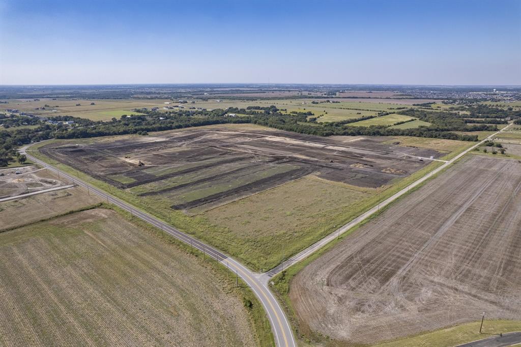 Expansive parcel of cleared land featuring mature perimeter trees, level topography, and dual-road frontage Expansive parcel of cleared land featuring mature perimeter trees, level topography, and dual-road frontage