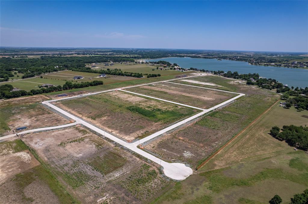Expansive undeveloped land parcels featuring paved infrastructure, street lighting, and proximity to the waterfront