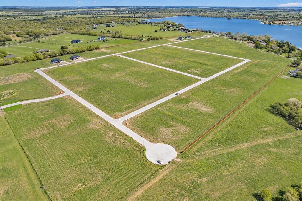 Expansive acreage featuring paved streets, concrete cul-de-sacs, and proximity to a large body of water