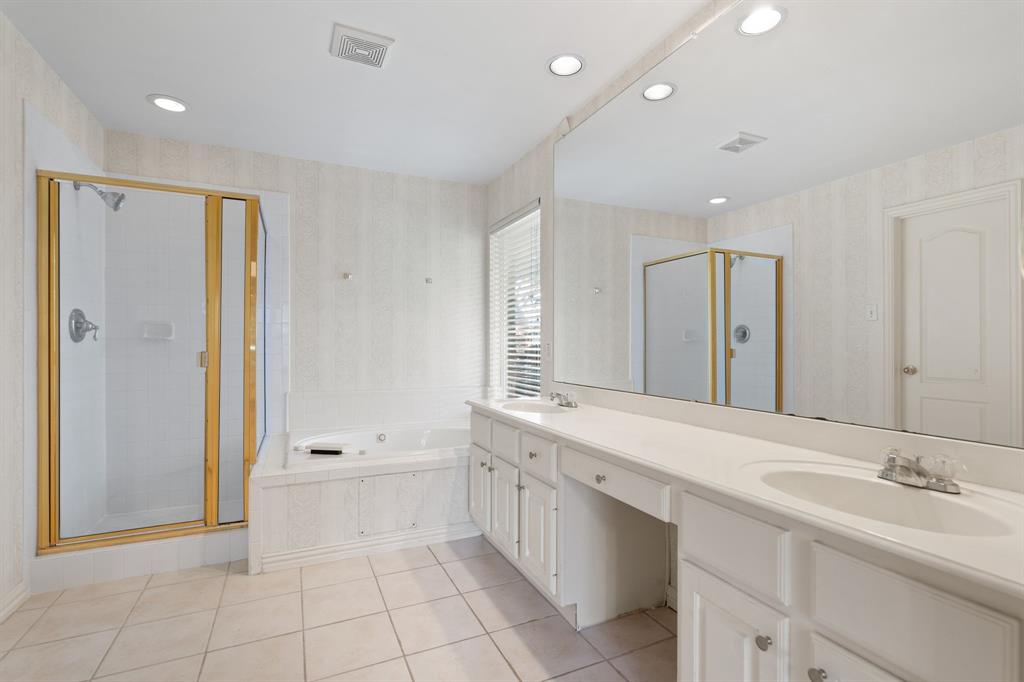Full bathroom with a stall shower, a bath, double vanity, tile patterned floors, and recessed lighting