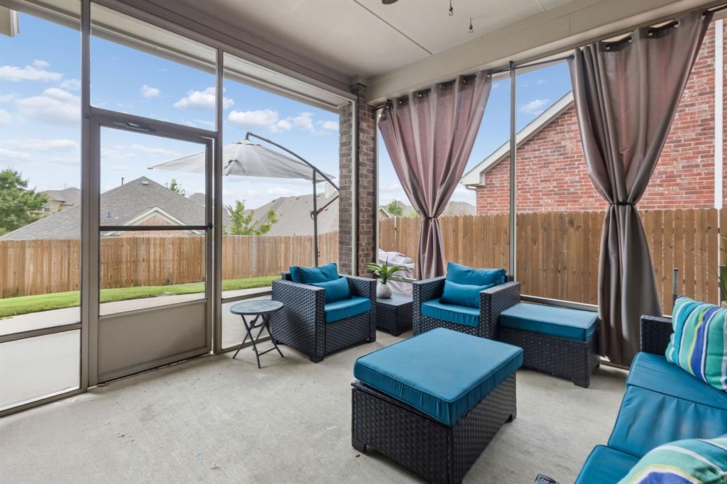 Enjoy the outdoors year-round on this beautifully finished, screened-in patio, complete with a ceiling fan for added comfort. There is also uncovered patio area outside of the screened in patio.