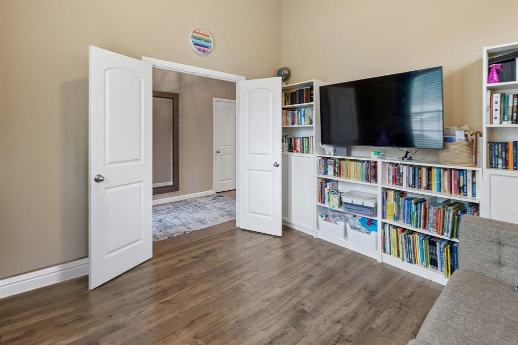 Another look at the office, highlighting the beautiful French doors that add an elegant touch and provide a welcoming entry to the space.