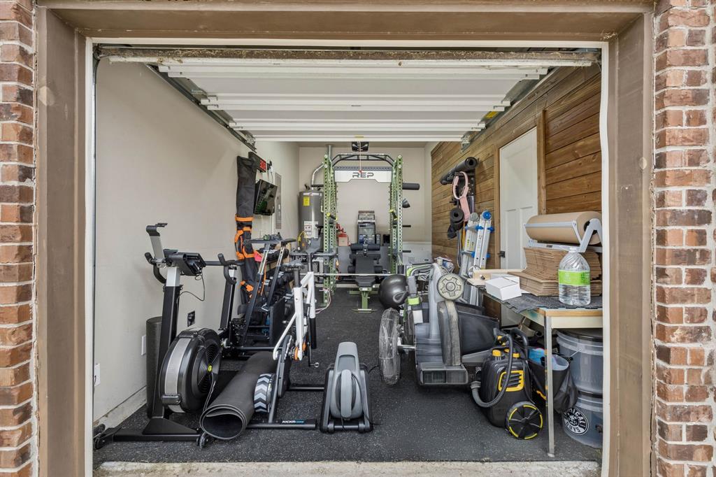 The third garage space offers added flexibility and is currently set up as a convenient home gym.