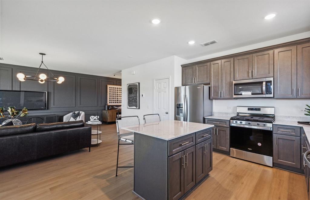 *Model Representation - Large island gathering room and dining areas overlooking