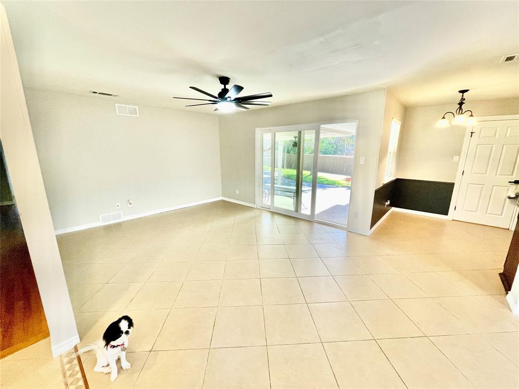 Den and small dining room.  Large sliding glass door to backyard.  Puppy does not come with house.
