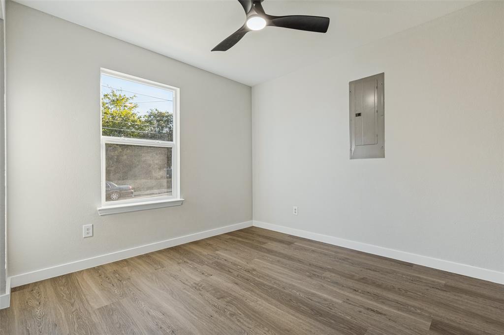 Room featuring luxury vinyl plank and ceiling fan