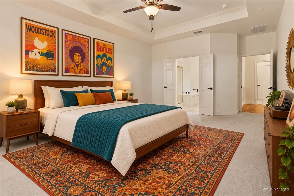 Tray ceiling, ceiling fan with integrated lighting, and neutral carpeting