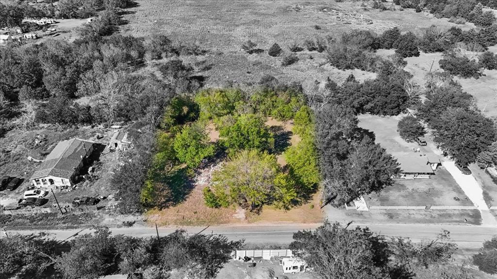 Expansive parcel of land featuring mature trees and established vegetation Expansive parcel of land featuring mature trees and established vegetation