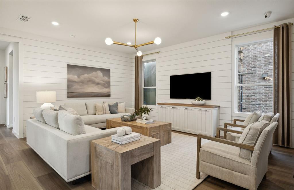 *Model Representation - Spacious gathering room with large windows