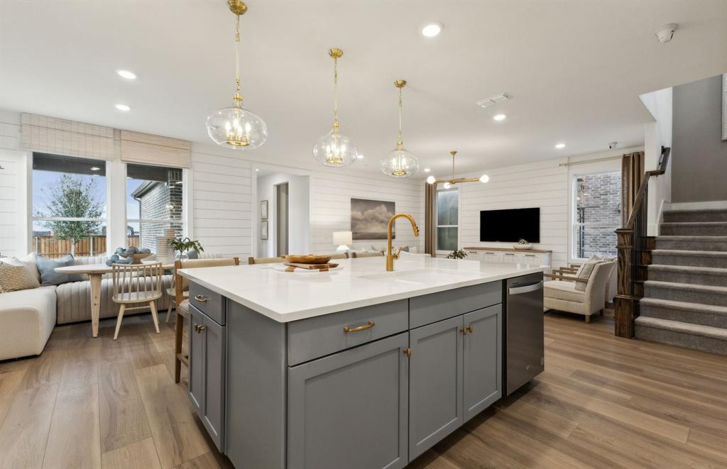 *Model Representation - Large island gathering room and dining areas overlooking