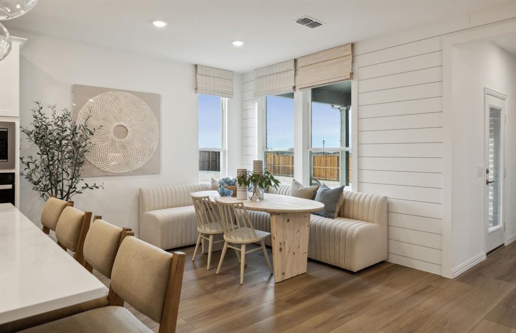 *Model Representation - Dining area off kitchen with large windows
