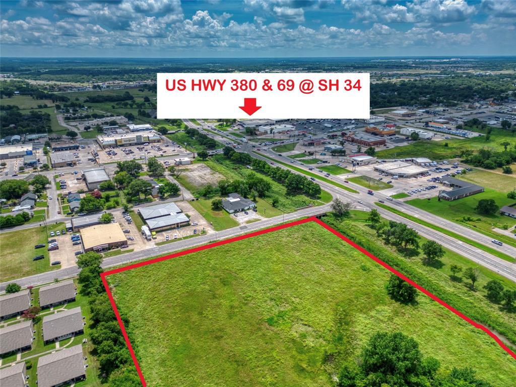 Expansive plot of land with frontage on a primary thoroughfare and proximity to established commercial infrastructure