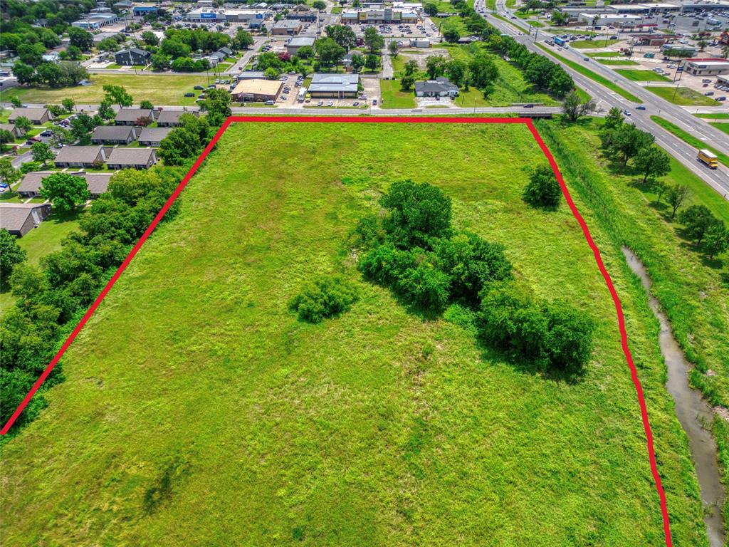 Expansive, open-lot land parcel featuring established mature trees and natural topography