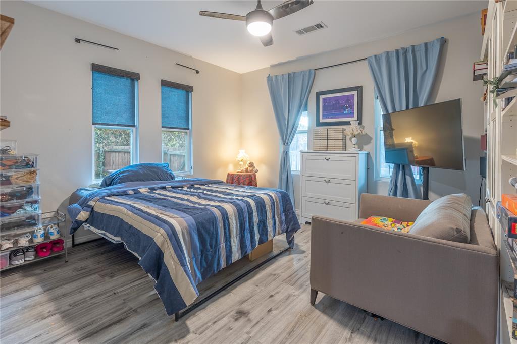 Spacious front bedroom looks out to front porch