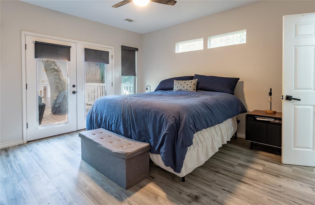 Primary bedroom opens up to a spacious and private backyard.